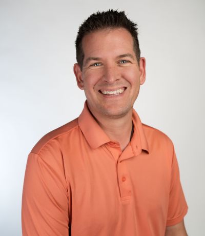 Ingram Rich A smiling man with short, dark hair and blue eyes, wearing an orange polo shirt, identified as Ingram Rich, Director of Warehouse. His favorite product is Snickerdoodle BRM with Vanilla Ice Cream.